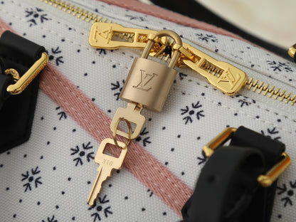 Speedy-Style Handbag With Pink Crisscross Strap Details